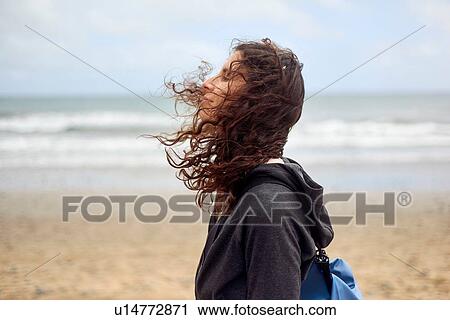 Female tourist with flyaway hair on beach, Las Palmas, Gran Canaria, Canary Islands, Spain View Large Photo Image Stock Image - Female tourist with flyaway hair on beach, Las Palmas, Gran Canaria, Canary Islands, Spain. Fotosearch