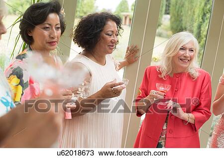 Female wedding guests at reception View Large Photo Image Stock Image - Female wedding guests at reception. Fotosearch