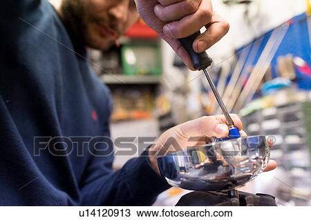 Stock Image - Fencing prop maker at work. Fotosearch