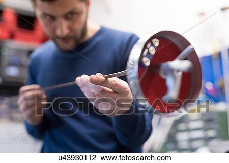 Fencing prop maker at work View Large Photo Image Stock Image - Fencing prop maker at work. Fotosearch