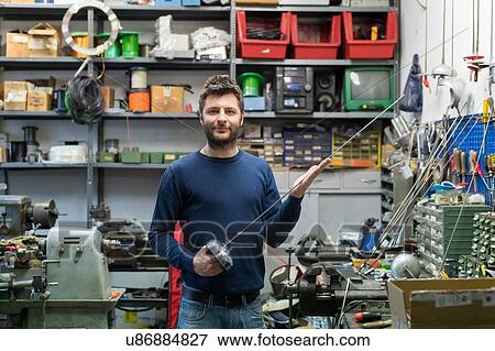 Fencing prop maker posing with fencing sword View Large Photo Image Stock Photo - Fencing prop maker posing with fencing sword. Fotosearch