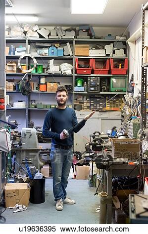 Stock Photography - Fencing prop maker posing with fencing sword. Fotosearch