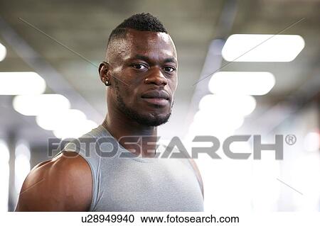 Stock Image - Fit man in gym. Fotosearch