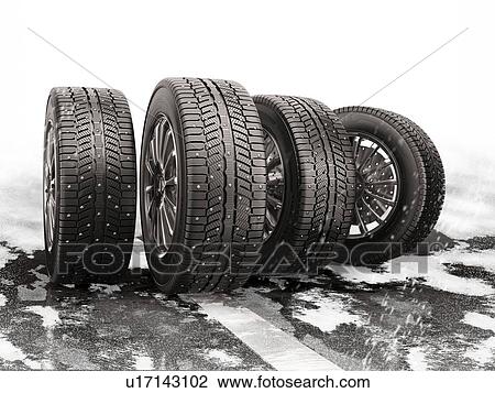 Stock Image - Four car tyres rolling on a snow-covered road. 3d illustration.. Fotosearch