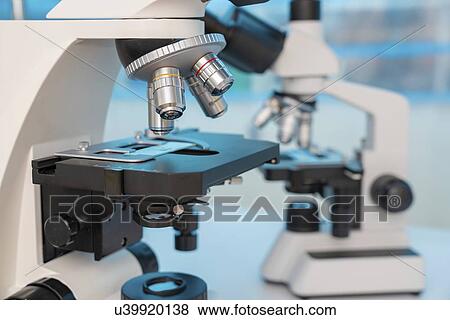 Four microscopes of different designs. View Large Photo Image Stock Photo - Four microscopes of different designs.. Fotosearch