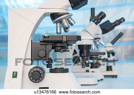 Four microscopes of different designs. View Large Photo Image Stock Photograph - Four microscopes of different designs.. Fotosearch