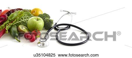 Stock Photography - Fresh fruit and vegetables with stethoscope, studio shot.. Fotosearch