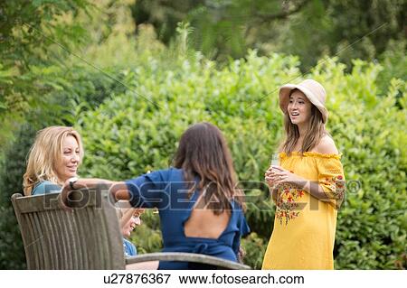 Stock Photo - Friends at picnic party in park. Fotosearch