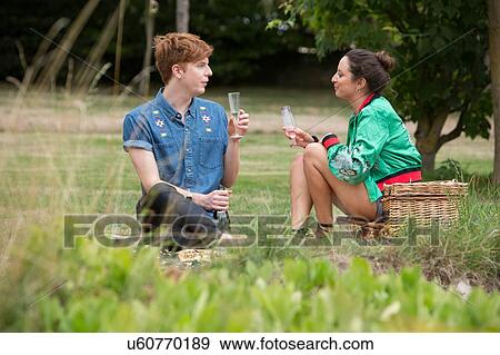 Friends at picnic party in park View Large Photo Image Stock Photo - Friends at picnic party in park. Fotosearch