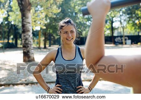 Friends exercising in park View Large Photo Image Stock Photo - Friends exercising in park. Fotosearch
