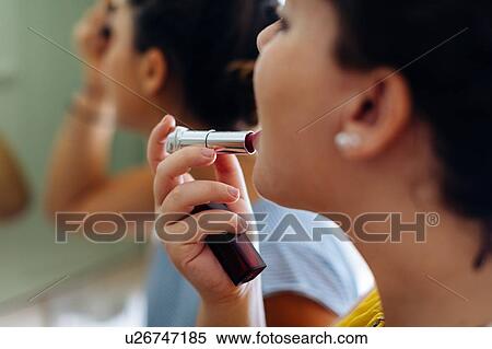 Friends putting on makeup at mirror View Large Photo Image Stock Photography - Friends putting on makeup at mirror. Fotosearch