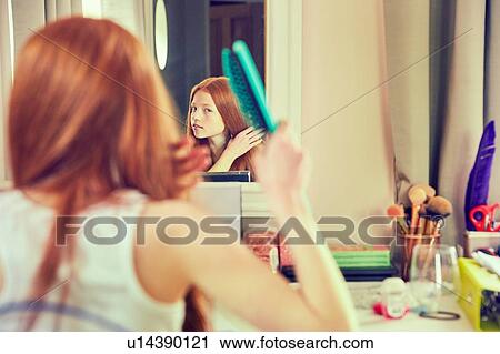 Girl brushing hair View Large Photo Image Stock Image - Girl brushing hair. Fotosearch