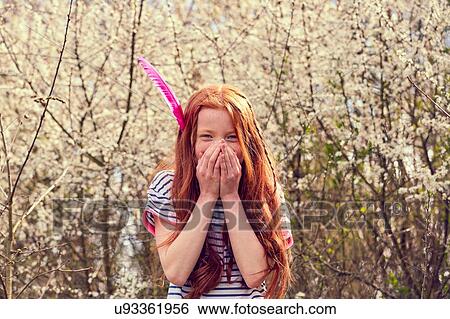 Girl covering mouth with hands View Large Photo Image Stock Photograph - Girl covering mouth with hands. Fotosearch