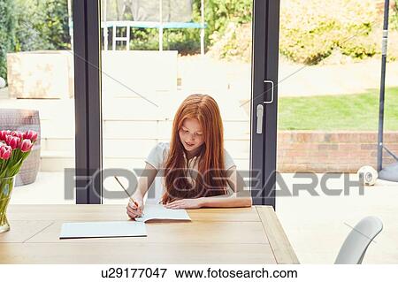 Girl doing homework View Large Photo Image Stock Photo - Girl doing homework. Fotosearch