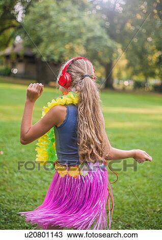 Girl hula dancing in park View Large Photo Image Stock Image - Girl hula dancing in park. Fotosearch