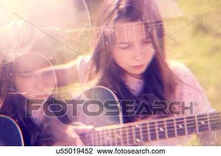 Girl playing guitar View Large Photo Image Stock Image - Girl playing guitar. Fotosearch