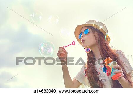 Girl playing with soap bubbles View Large Photo Image Stock Image - Girl playing with soap bubbles. Fotosearch