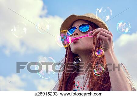 Girl playing with soap bubbles View Large Photo Image Stock Image - Girl playing with soap bubbles. Fotosearch