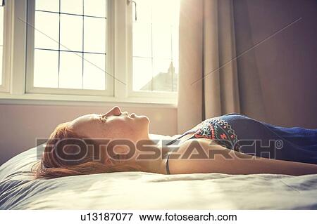 Girl sleeping in bed View Large Photo Image Stock Photo - Girl sleeping in bed. Fotosearch