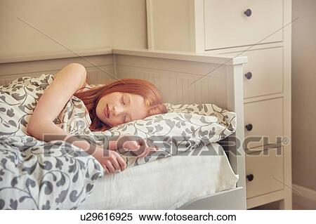 Girl sleeping in bed View Large Photo Image Stock Photography - Girl sleeping in bed. Fotosearch