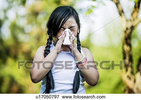 Girl using handkerchief while sneezing. View Large Photo Image Stock Photo - Girl using handkerchief while sneezing.. Fotosearch