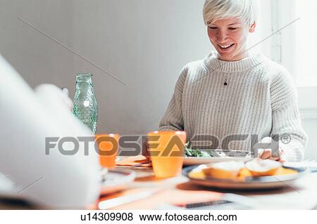 Girlfriends having lunch at home View Large Photo Image Stock Photo - Girlfriends having lunch at home. Fotosearch