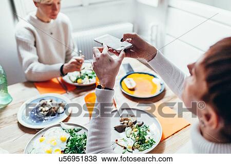 Girlfriends having lunch at home View Large Photo Image Stock Photo - Girlfriends having lunch at home. Fotosearch