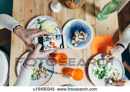 Girlfriends having lunch at home View Large Photo Image Stock Photography - Girlfriends having lunch at home. Fotosearch