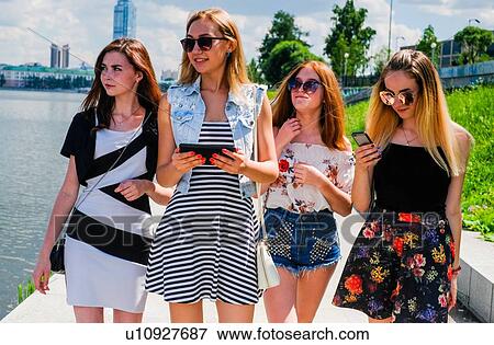Stock Photo - Girlfriends on city break. Fotosearch