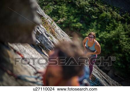 Picture - Girlfriends rock climbing, Malamute, Squamish, Canada. Fotosearch
