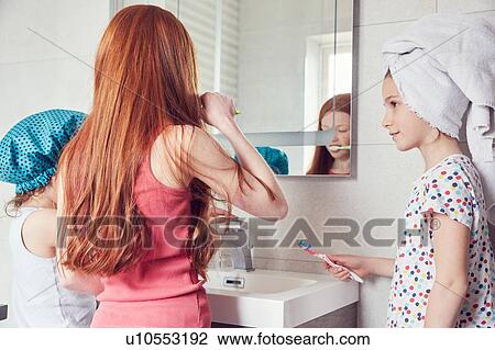 Girls brushing teeth View Large Photo Image Stock Image - Girls brushing teeth. Fotosearch