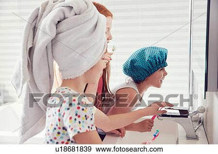 Girls brushing teeth View Large Photo Image Stock Photo - Girls brushing teeth. Fotosearch