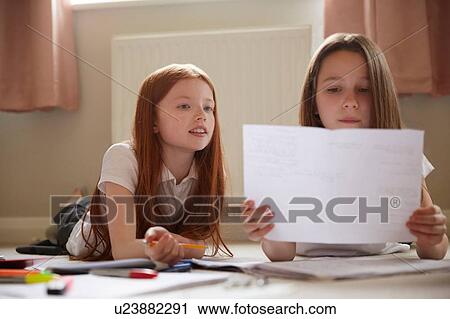 Girls doing homework View Large Photo Image Stock Image - Girls doing homework. Fotosearch