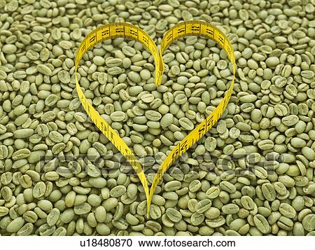 Green coffee beans and heart shape tape measure. View Large Photo Image Stock Image - Green coffee beans and heart shape tape measure.. Fotosearch