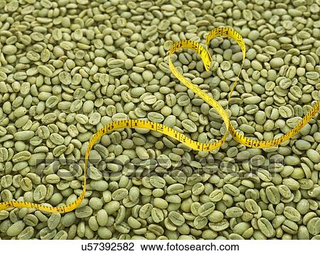 Green coffee beans and heart shape tape measure. View Large Photo Image Stock Image - Green coffee beans and heart shape tape measure.. Fotosearch