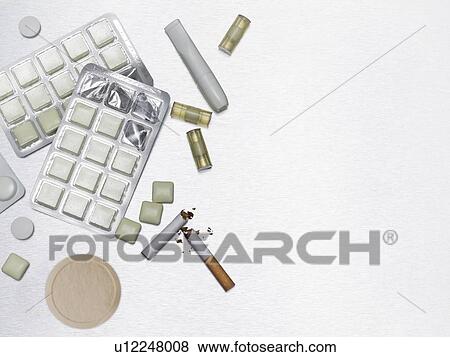Stock Photo - Gum and pills to help stop smoking.. Fotosearch