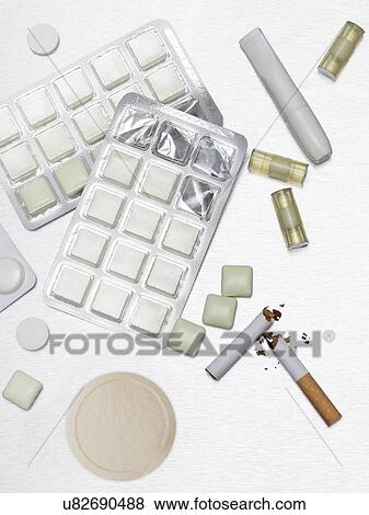 Stock Photo - Gum and pills to help stop smoking.. Fotosearch