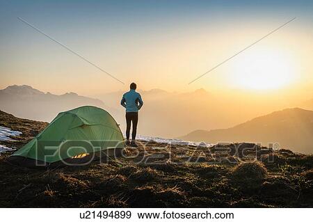 Stock Photo - Hiker camping on French Alps, Parc naturel rgional du Massif des Bauges, Chatelard-en-Bauges, Rhone-Alpes, France. Fotosearch
