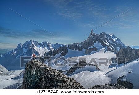 Hiker enjoying scenery, Chamonix-Mont-Blanc, Rhone-Alpes, France View Large Photo Image Stock Image - Hiker enjoying scenery, Chamonix-Mont-Blanc, Rhone-Alpes, France. Fotosearch