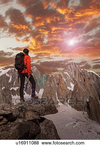 Hiker enjoying scenery, Chamonix-Mont-Blanc, Rhone-Alpes, France View Large Photo Image Stock Photo - Hiker enjoying scenery, Chamonix-Mont-Blanc, Rhone-Alpes, France. Fotosearch