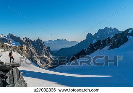Hiker enjoying scenery, Chamonix-Mont-Blanc, Rhone-Alpes, France View Large Photo Image Stock Photograph - Hiker enjoying scenery, Chamonix-Mont-Blanc, Rhone-Alpes, France. Fotosearch