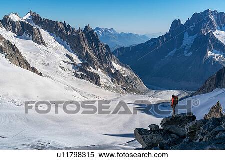 Stock Photography - Hiker enjoying scenery, Chamonix-Mont-Blanc, Rhone-Alpes, France. Fotosearch