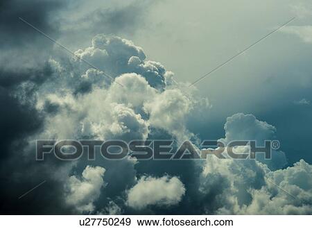 Stock Photo - Huge clouds growing rapidly into thunderstorms. Fotosearch