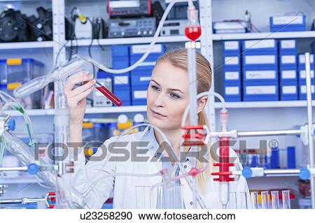 Laboratory assistant with chemical experiment. View Large Photo Image Stock Image - Laboratory assistant with chemical experiment.. Fotosearch