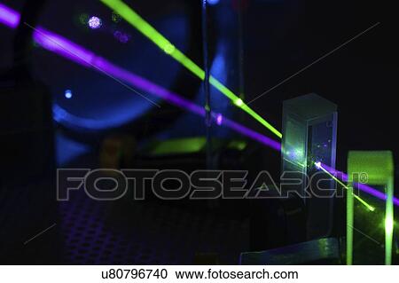 Stock Image - Laser experiment in photonics laboratory.. Fotosearch