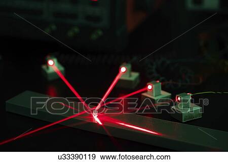 Stock Photo - Laser experiment in photonics laboratory.. Fotosearch