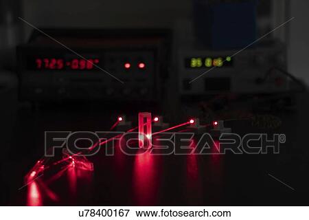 Stock Photo - Laser experiment in photonics laboratory.. Fotosearch
