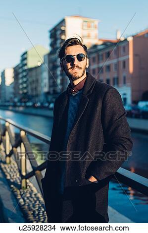 Picture - Man by canal, Milan, Italy. Fotosearch