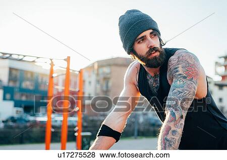 Man in outdoor gym View Large Photo Image Stock Photo - Man in outdoor gym. Fotosearch