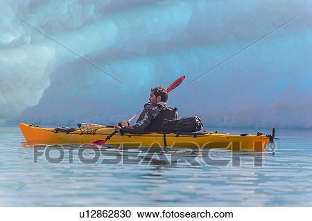 Man kayaking near glacier, Narsaq, Vestgronland, Greenland View Large Photo Image Stock Image - Man kayaking near glacier, Narsaq, Vestgronland, Greenland. Fotosearch